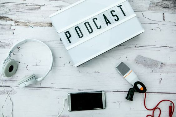 podcast on white wooden table